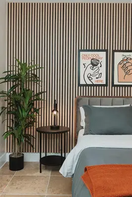 a bedroom with a bed and a striped wall at Cozy Miami Suite with FREE Parking in Miami