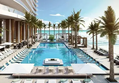 a resort with a swimming pool with palm trees and the ocean at LYFE, Rent Excelent Apartment in Resort, 4Pax ,Parcial Ocean View in Hollywood