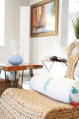 a room with two rattan chairs and a table at Stunning, Modern and Quiet Beach House in Hollywood