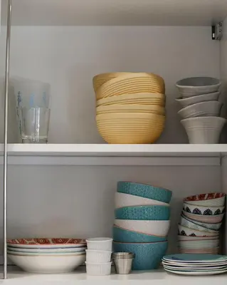 a shelf with bowls and plates on it at Stunning, Modern and Quiet Beach House in Hollywood