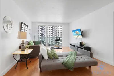 a living room with a couch and a table at Tides Great condo on the beach Big promotions in Hollywood