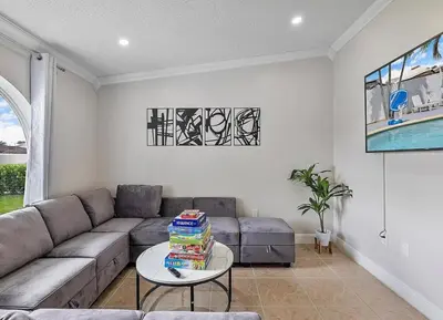 a living room with a couch and a table at Miami Oasis With Private Pool in Richmond West