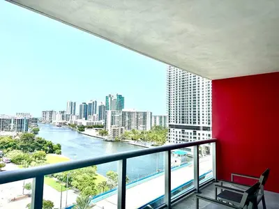 a balcony with a view of a river and buildings at Miami Beach 1B 1B Incredible View Apt with Kitchen in Hallandale Beach