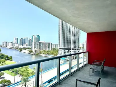 a balcony with a bench and a view of a river at Miami Beach 1B 1B Incredible View Apt with Kitchen in Hallandale Beach