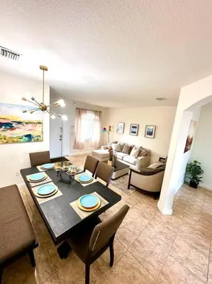 a living room with a table and chairs and a couch at Luxury DreamStay Miami 3BED 2BATH King Suite in Burrs Strip