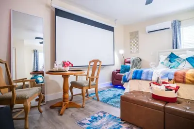 a bedroom with a bed and a table and chairs at Hidden Gem Luxe 1 BEDROOM & Patio in Cutler Bay