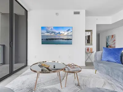 a living room with a coffee table and a couch at X Lounge V-Panoramic Private Residence in Miami