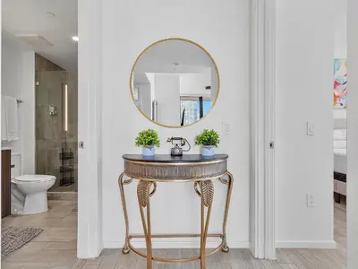 a bathroom with a table with a mirror on it at X Lounge V-Panoramic Private Residence in Miami