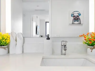 a white bathroom with a sink and a mirror at X Lounge V-Panoramic Private Residence in Miami