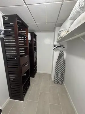 a walk in closet with bunk beds and a tiled floor at Beachfront one bedroom in the Tides in Hollywood in Hollywood