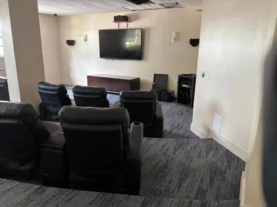 a waiting room with chairs and a flat screen tv at Beachfront one bedroom in the Tides in Hollywood in Hollywood