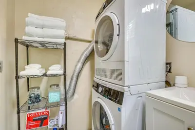 a washing machine in a bathroom next to a sink at 2 Mi to Hard Rock Stadium Studio in Miami Gardens in Miami