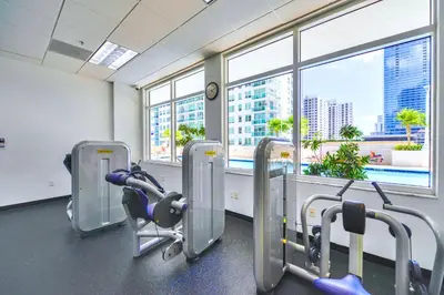 a gym with a view of a city at Elegant Retreat Brickell in Miami