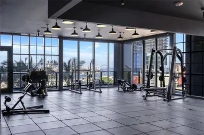 a gym with treadmills and machines in a building at Modern Stylish 1BR Apartment with Pool in Miami