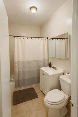 a bathroom with a toilet and a sink and a shower at Fauna Bizcaya in Gold Coast Heliport