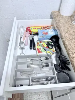 a drawer filled with kitchen utensils in a cabinet at Retreat in Style Private Peaceful Miami Bungalow in Olympia Heights