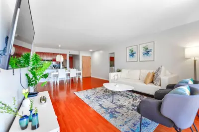 a living room with a white couch and a table at Upscale Condo in Brickell in Miami
