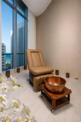 a waiting room with a chair and a bowl at Ventur Luxe Condo - Oceanview - Gym, Beach Access in Hollywood