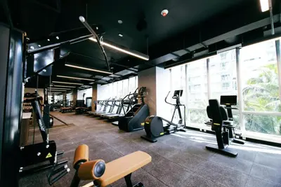 a gym with treadmills and cardio equipment in a building at Designer Studio Downtown Miami with Rooftop Pool and Gym in Miami