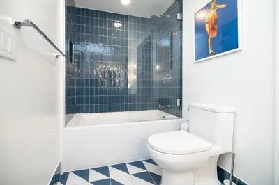 a bathroom with a toilet and a tub and a sink at Exquisite 2 Bedroom in the best location of Downtown Miami in Miami