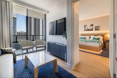 a bedroom with a bed and a living room at Exquisite 2 Bedroom in the best location of Downtown Miami in Miami