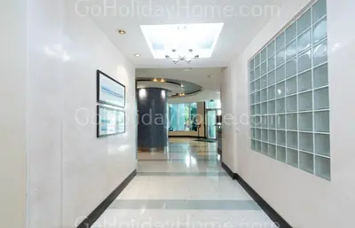 a hallway of a building with glass panels on the walls at Direct access to the beach, pool and parking 3T in Hollywood