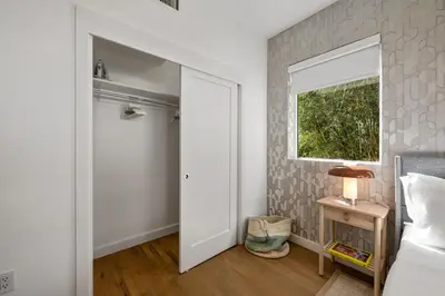 a bedroom with a white door and a window at Lux Designer Apt 2BR and 2BA in the Heart of MIA Beach in Miami Beach