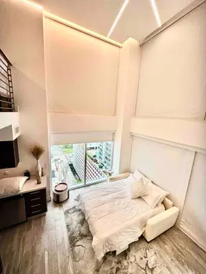 a white bedroom with a large bed and a window at LOFT Brickell River 10 min To South Beach in Miami