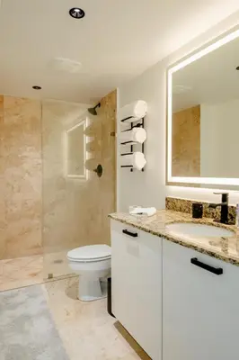 a bathroom with a toilet and a sink and a shower at LOFT Brickell River 10 min To South Beach in Miami