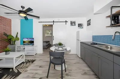a kitchen with a ceiling fan and a counter top at Luna Beach House in Hollywood