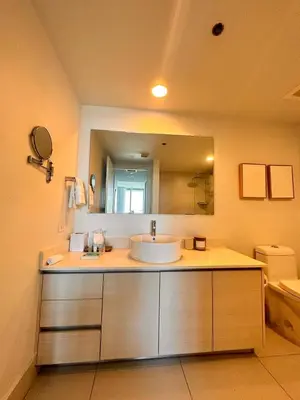 a bathroom with a sink and a large mirror at Apartment in Miami Beach with Kitchen, Beach Service and Gym in Hallandale Beach