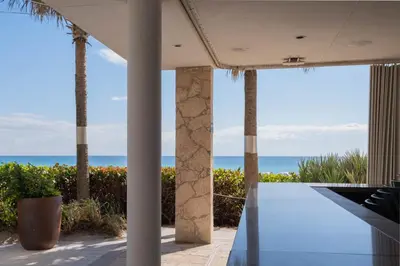 a view of the ocean from the patio of a house at Apartment in Miami Beach with Kitchen, Beach Service and Gym in Hallandale Beach