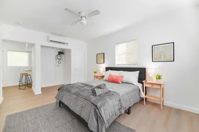 a bedroom with a bed and a ceiling fan at Stylish Studio Near Miami Relevant Spots in Miami