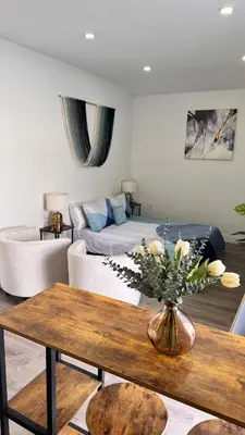 a living room with a couch and a table at Miami North Beach in North Miami Beach