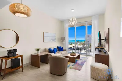 a living room with a view of the ocean at Stylish Nice Apt Hollywood Beach Boardwalk in Hollywood
