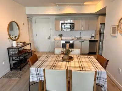a kitchen and dining room with a table and chairs at Miami Beach 1B 1B w Kitchen and Beach Service in Hallandale Beach