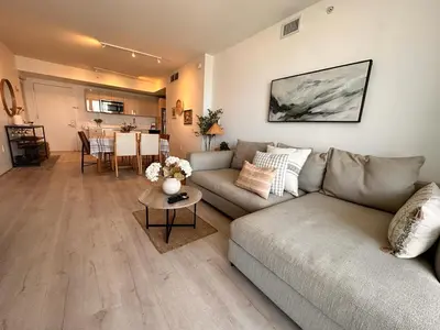 a living room with a couch and a table at Miami Beach 1B 1B w Kitchen and Beach Service in Hallandale Beach