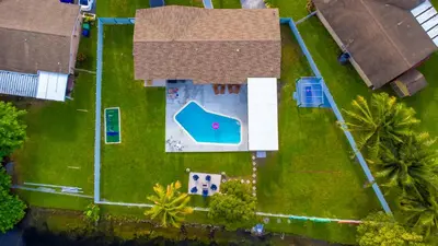 an overhead view of a house with a yard at Hard Rock Paradise in Andover Lakes Estates