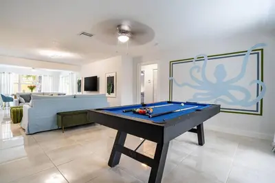 a living room with a pool table in it at Central 3BD wPool and Covered Patio 10 min to FLL in Fort Lauderdale
