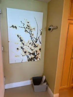 a painting hanging on a wall in a room at Castle beach studio,tennis court and swimming pool with beach access in Miami Beach