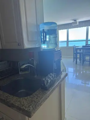 a kitchen counter with a mixer and a sink at Castle beach studio,tennis court and swimming pool with beach access in Miami Beach