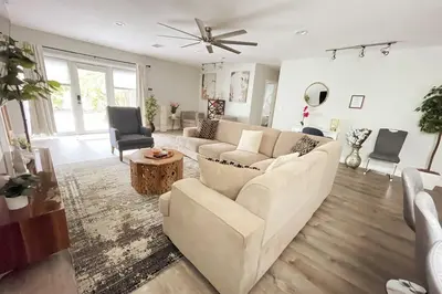 a living room with a couch and a table at La Dolce Villa in Fort Lauderdale