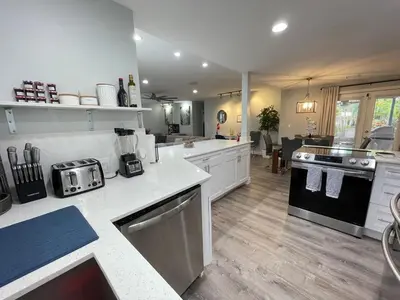 a large kitchen with white counter tops and appliances at La Dolce Villa in Fort Lauderdale
