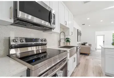 a kitchen with a stainless steel stove top oven at Beautiful House in Coral Gables FL in Miami