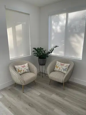 a living room with two chairs and a window at Beautiful House in Coral Gables FL in Miami