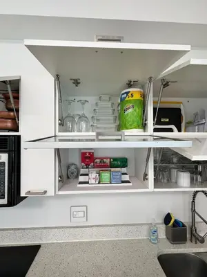 an open kitchen pantry with plates and dishes at Fully Equipped Modern Loft in the heart of Miami in Miami