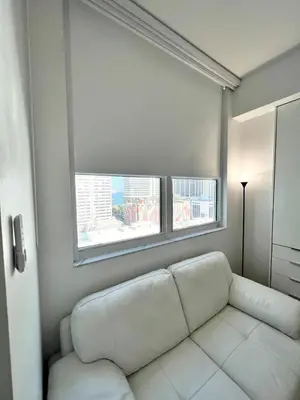 a white couch in a room with a window at Fully Equipped Modern Loft in the heart of Miami in Miami