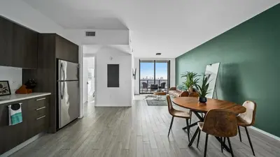 a kitchen and dining room with a table and chairs at 2-Bedr Downtown Miami Condo Bay Views in Miami