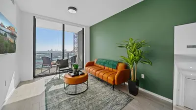 a living room with a couch and a table at 2-Bedr Downtown Miami Condo Bay Views in Miami