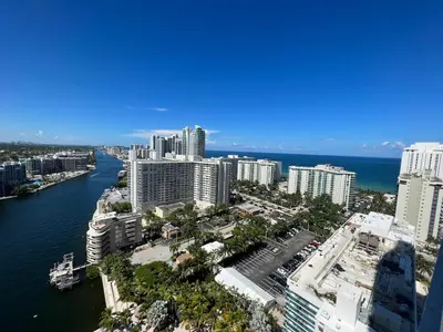 an aerial view of a city with a river and buildings at Beachfront Apt with Gym, Pool, and Rest in Miami in Hollywood